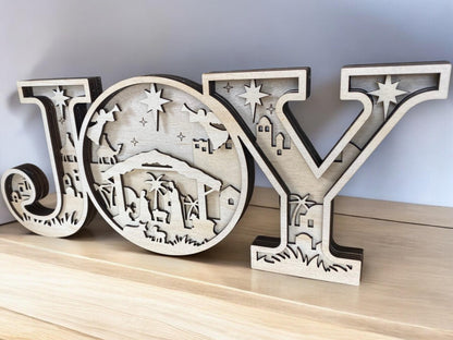 Laser cut wooden nativity scene inside JOY Christmas sign for mantel or shelf