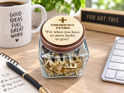 Funny swear jar office gift displayed on desk with keyboard, coffee mug and office accessories